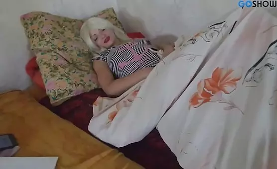 Blonde teases with fingers while caressing her cunt